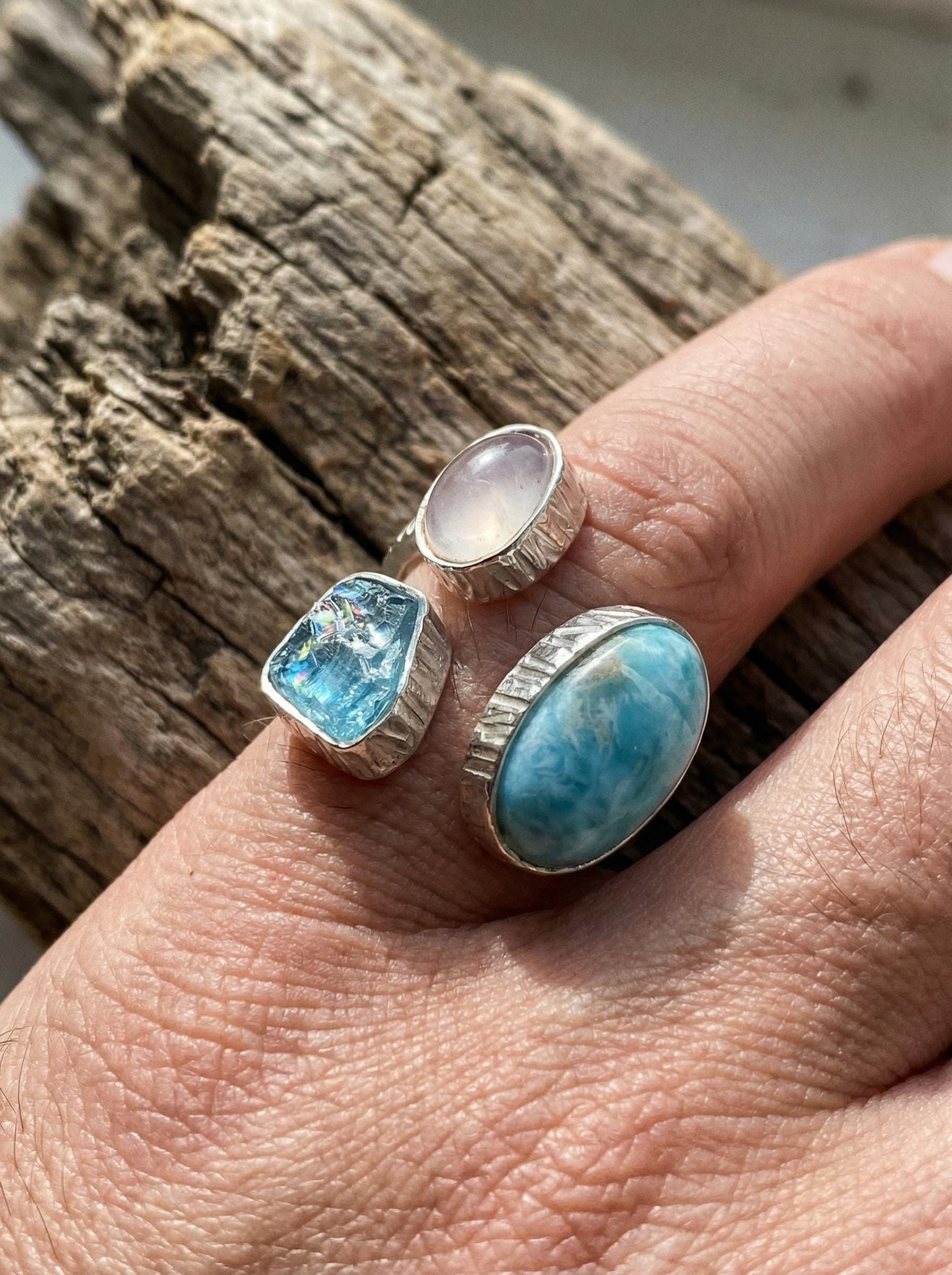 Triple stone sterling silver ring shown worn on hand with Larimar, Blue Apatite, and Moonstone details.