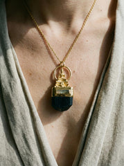 MBuddha Black Tourmaline and Smoky Quartz talisman pendant shown worn as a grounding spiritual necklace.