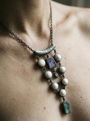 South Sea Pearl Charoite Moonstone Aquamarine pendant shown worn on the chest with oxidized silver and pearl cascade.