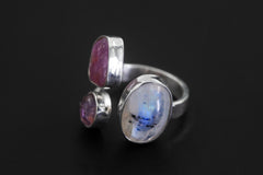 Inner Flame Multi Stone Ring shown worn on hand with Blue Moonstone, Ruby, Amethyst, and adjustable sterling silver band.