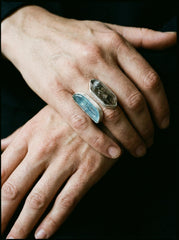 Tide and Shadow Smoky Quartz and Aquamarine Ring shown worn on hand with adjustable sterling silver dual stone setting.
