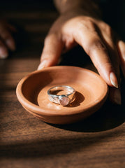 Eternal Rose Quartz Hammered Ring shown in a small bowl with round Rose Quartz and hammered sterling silver setting.