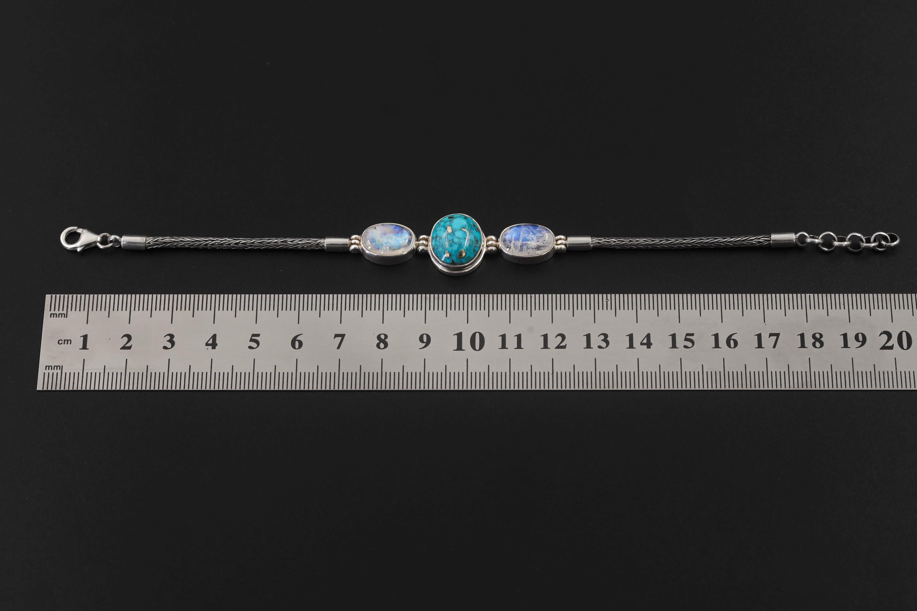 Turquoise Moonstone sterling silver bracelet shown beside a ruler for 18 to 20 cm adjustable length reference.