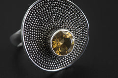 Close view of Citrine disc ring showing golden gemstone in raised silver bezel and micro ball texture.