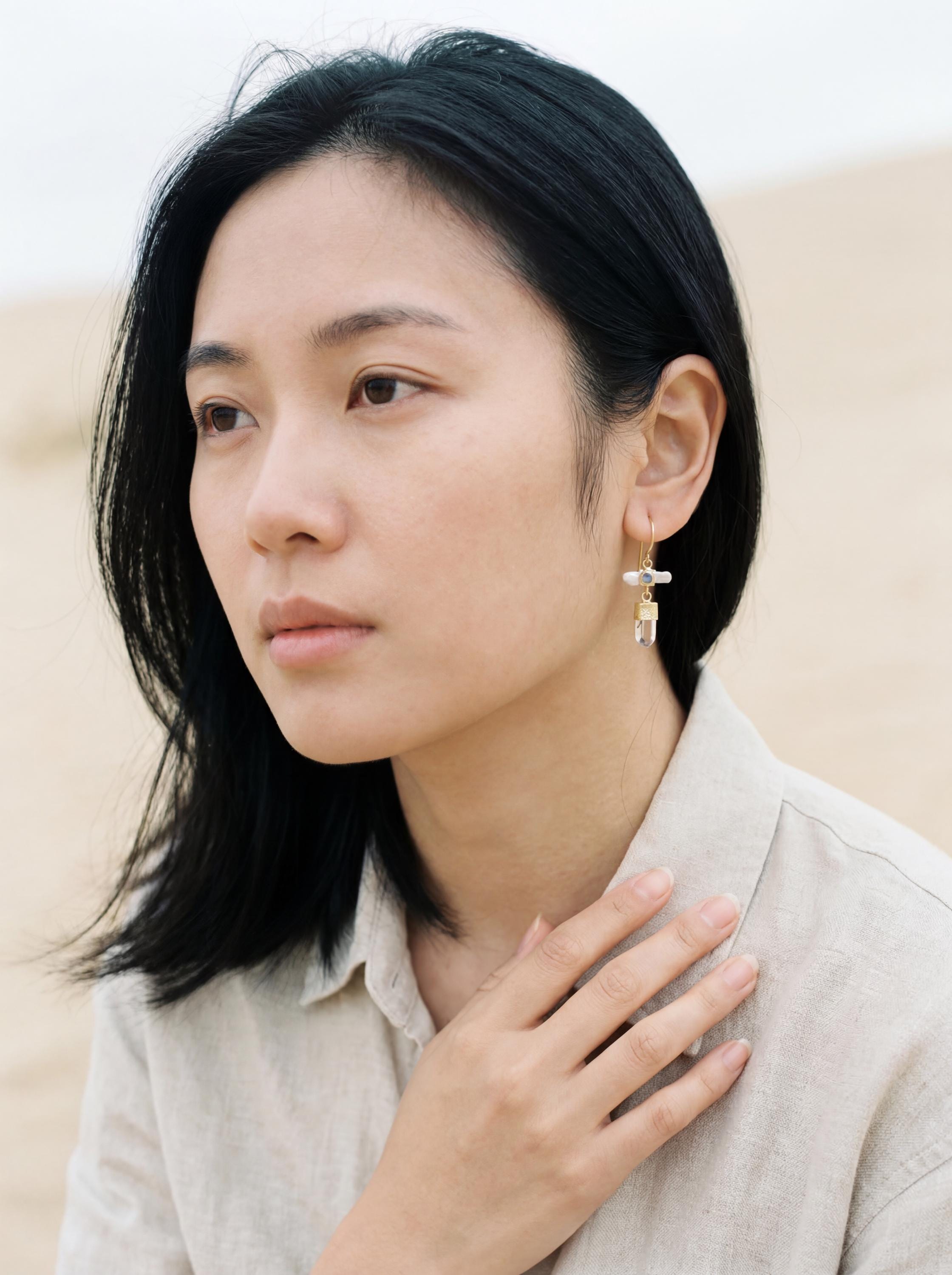 Gold-plated Pearl Moonstone Australian Quartz earrings shown worn on a model, highlighting soft moonlight dangle movement.