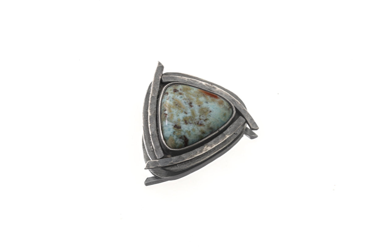 Larimar triangle pendant shown with chain on white background in oxidized sterling silver sun setting.