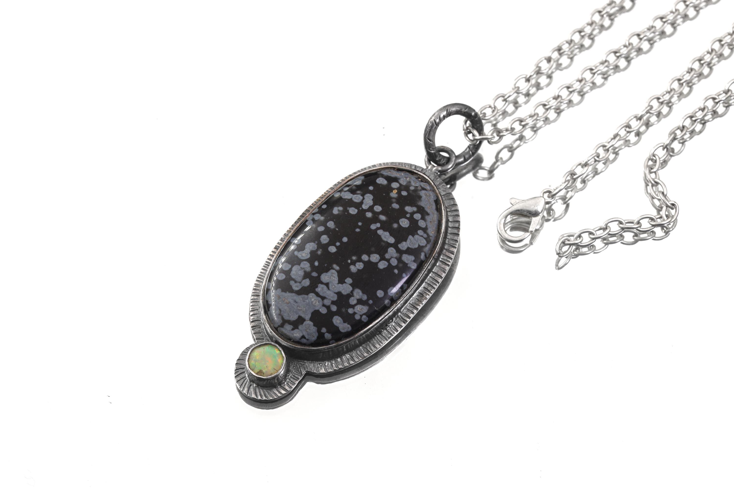 Dalmatian Jasper Ethiopian Opal sun pendant shown with sterling silver chain and textured handmade silver setting.
