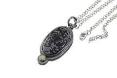 Dalmatian Jasper Ethiopian Opal sun pendant shown with sterling silver chain and textured handmade silver setting.