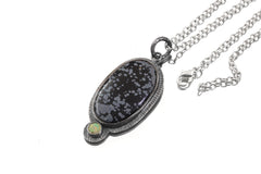Dalmatian Jasper Ethiopian Opal sun pendant shown with sterling silver chain and textured handmade silver setting.