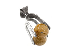 Golden Rutilated Quartz spinning pendant displayed in handmade sterling silver setting.