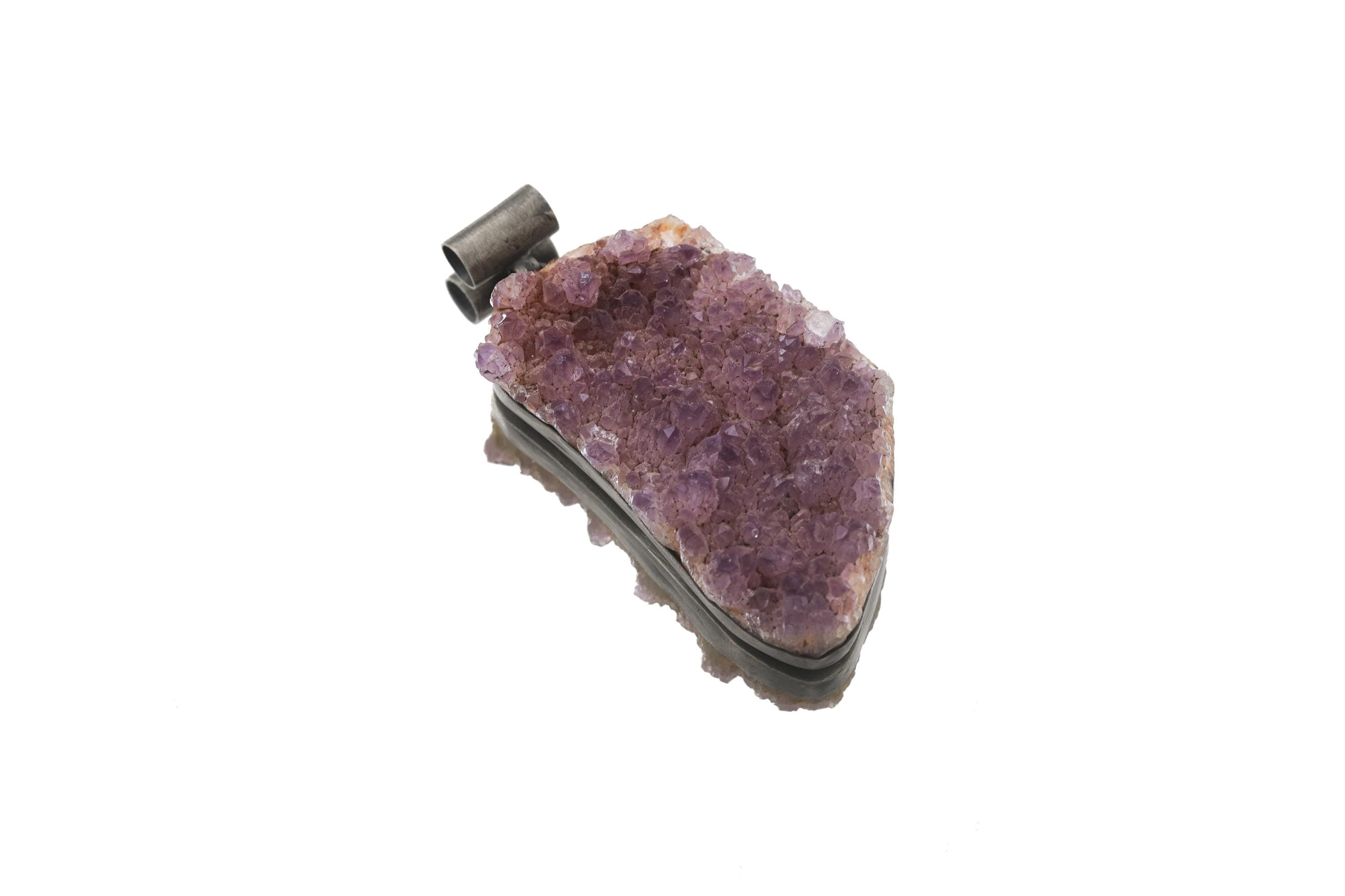 Side view of Amethyst druzy pendant showing oxidized sterling silver setting and raw crystal edge.
