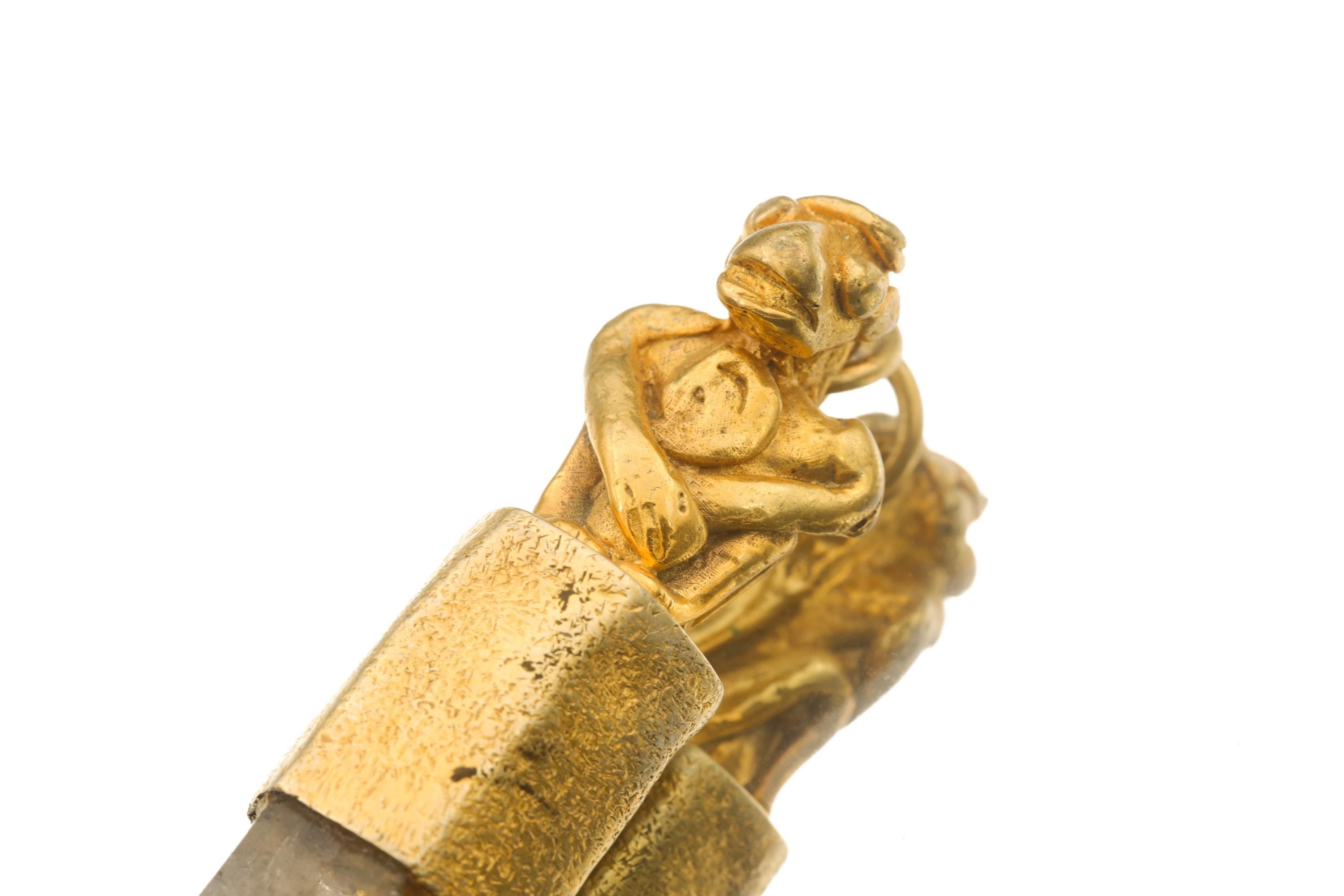 Monkey Tiger Lemurian Quartz pendant shown worn on a black necklace with gold-plated symbolic animal figure.