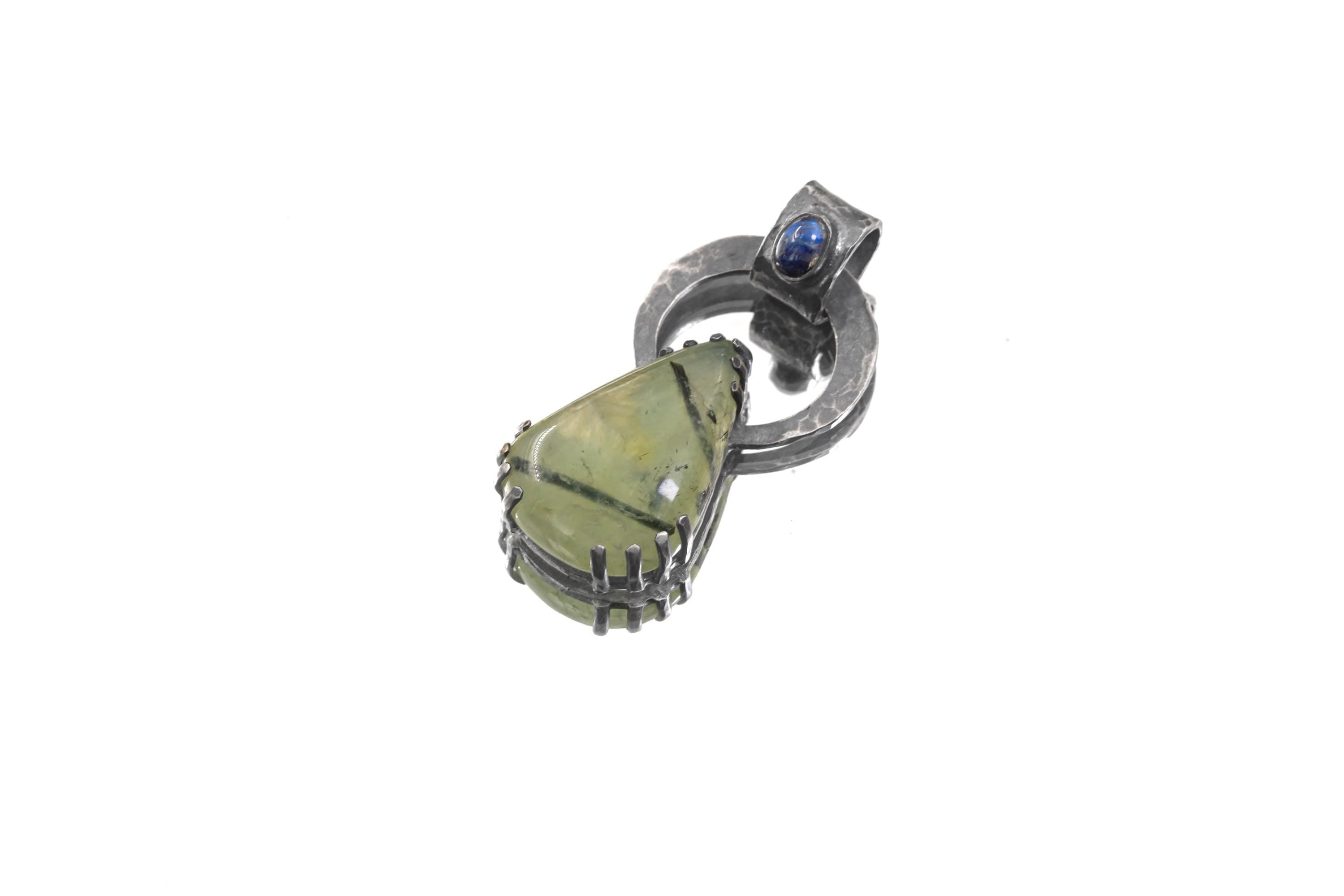 Blue Moonstone Peridot heirloom pendant shown on white background with heavy claw setting and open-back silverwork.