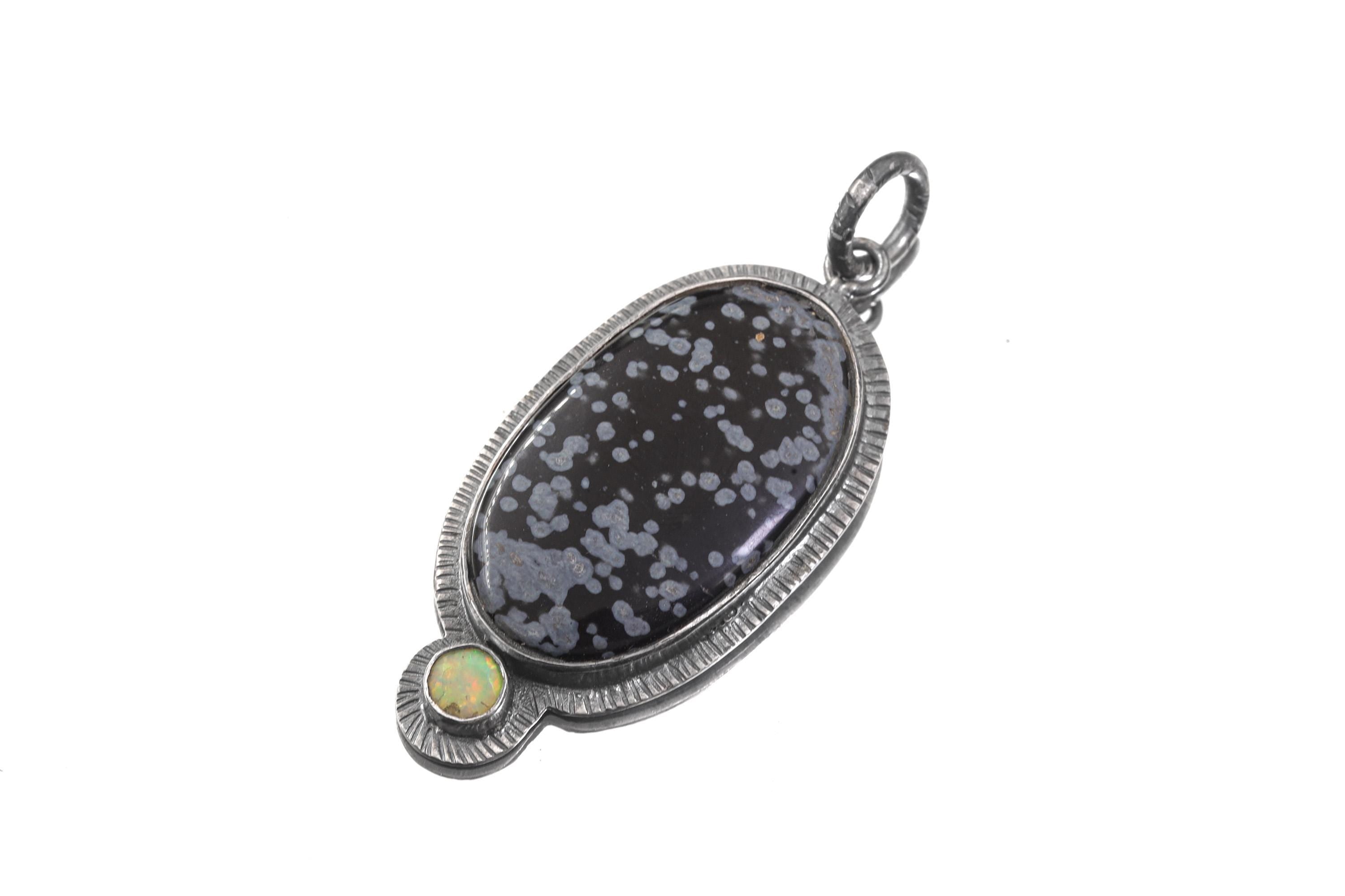 Dalmatian Jasper Ethiopian Opal pendant shown on white background with spotted gemstone and opal accent.