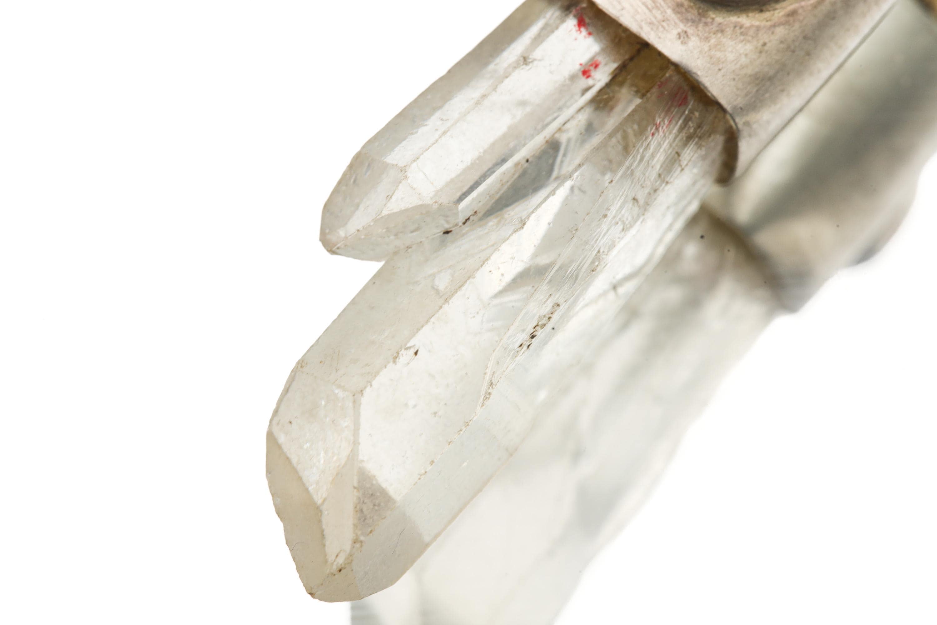 Close-up of Himalayan Twin Quartz crystal formation in a handmade Buddha talisman pendant.