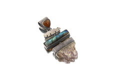 Vibrant Harmony multi-stone pendant shown on white background with Amethyst Geode, Labradorite, Quartz, and Opal.