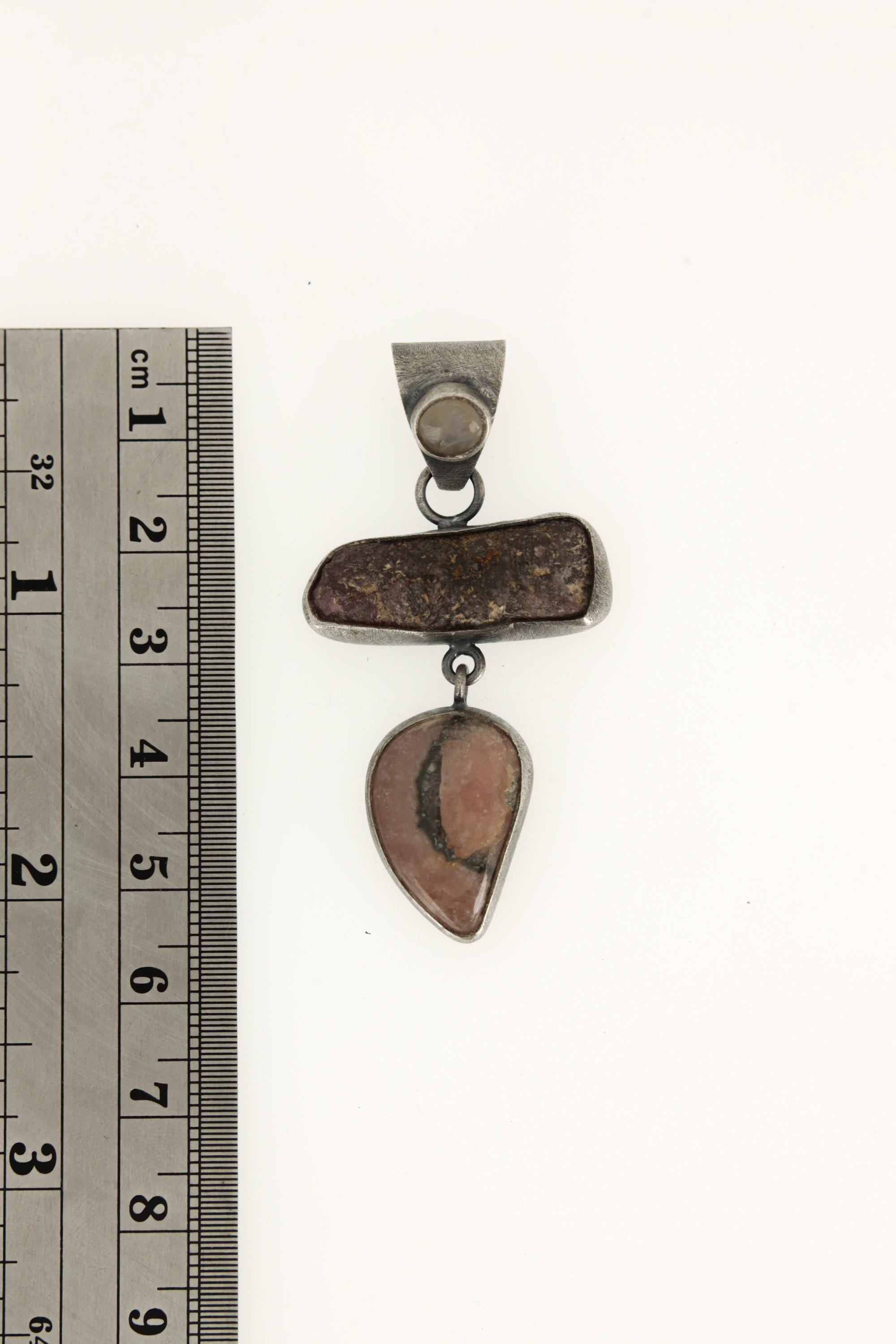 Multi-stone oxidized sterling silver pendant shown beside a ruler for approximately 6 cm length reference.