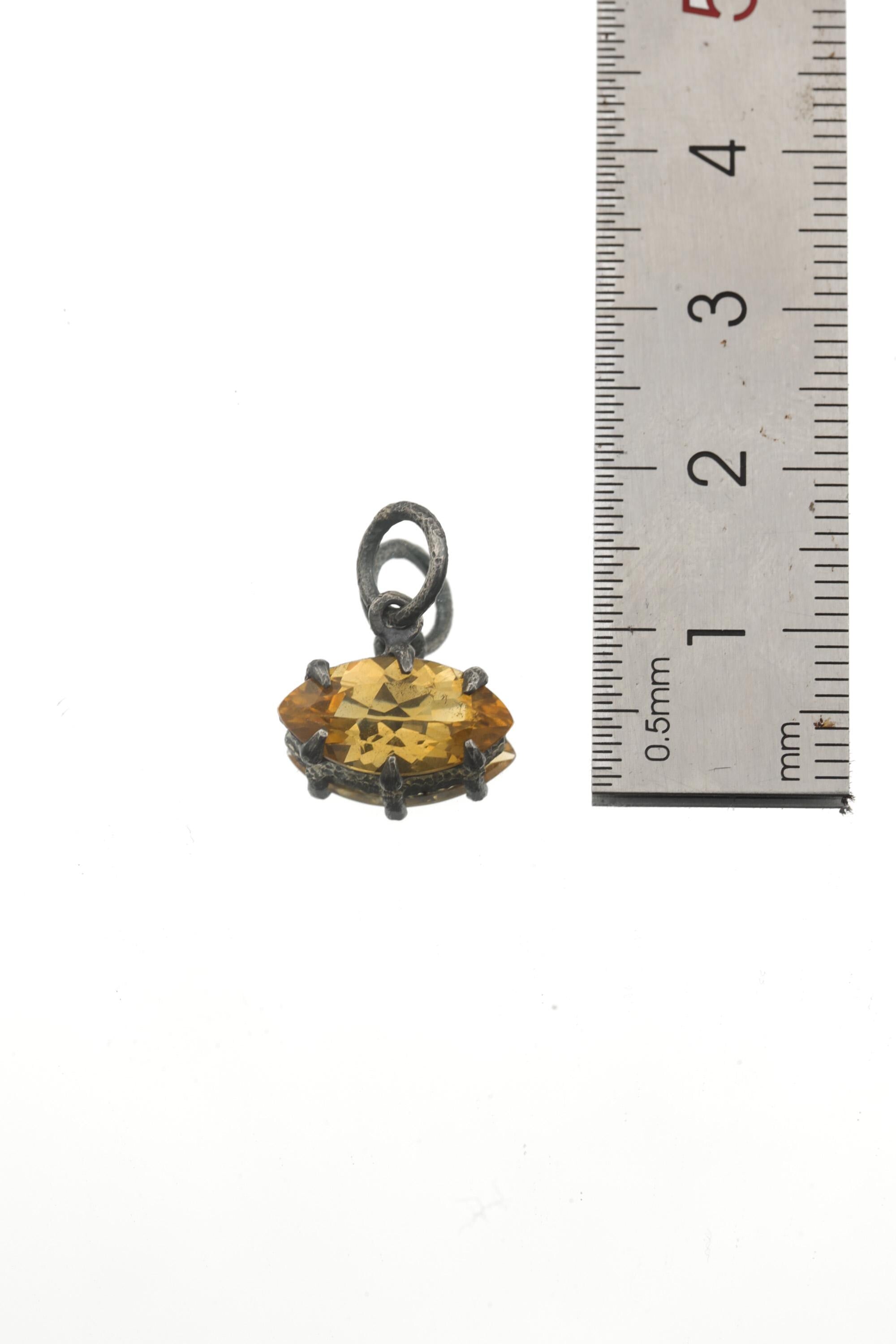 Citrine marquise pendant shown beside ruler for petite gemstone pendant size reference.