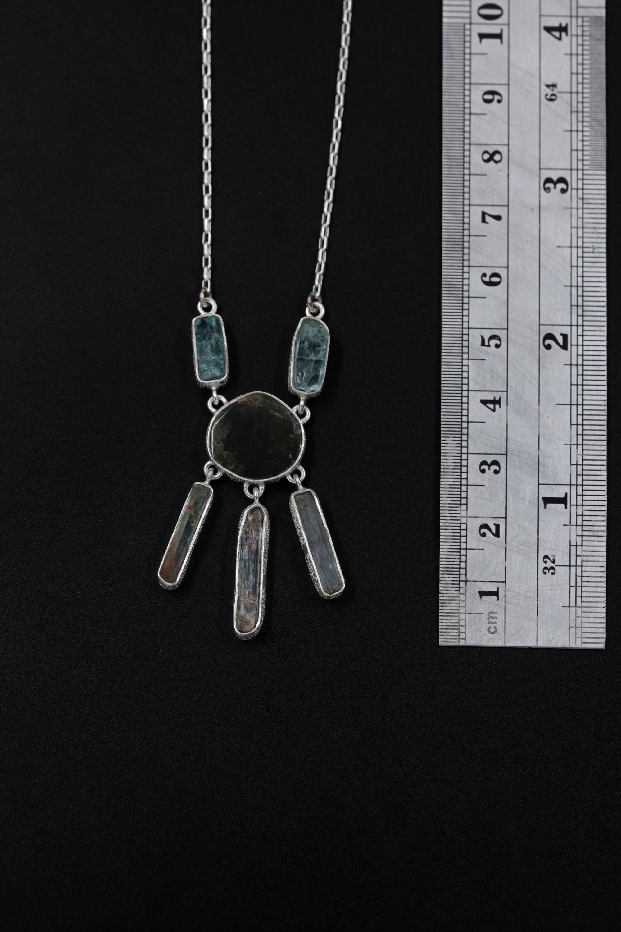 Forest Tide Awakening necklace shown beside a ruler for scale, with 5 cm pendant length and 16 to 18 inch box chain.