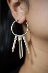 Smoky Quartz Pearl hoop earring worn on a model, showing large silver circle and stacked gemstone movement.