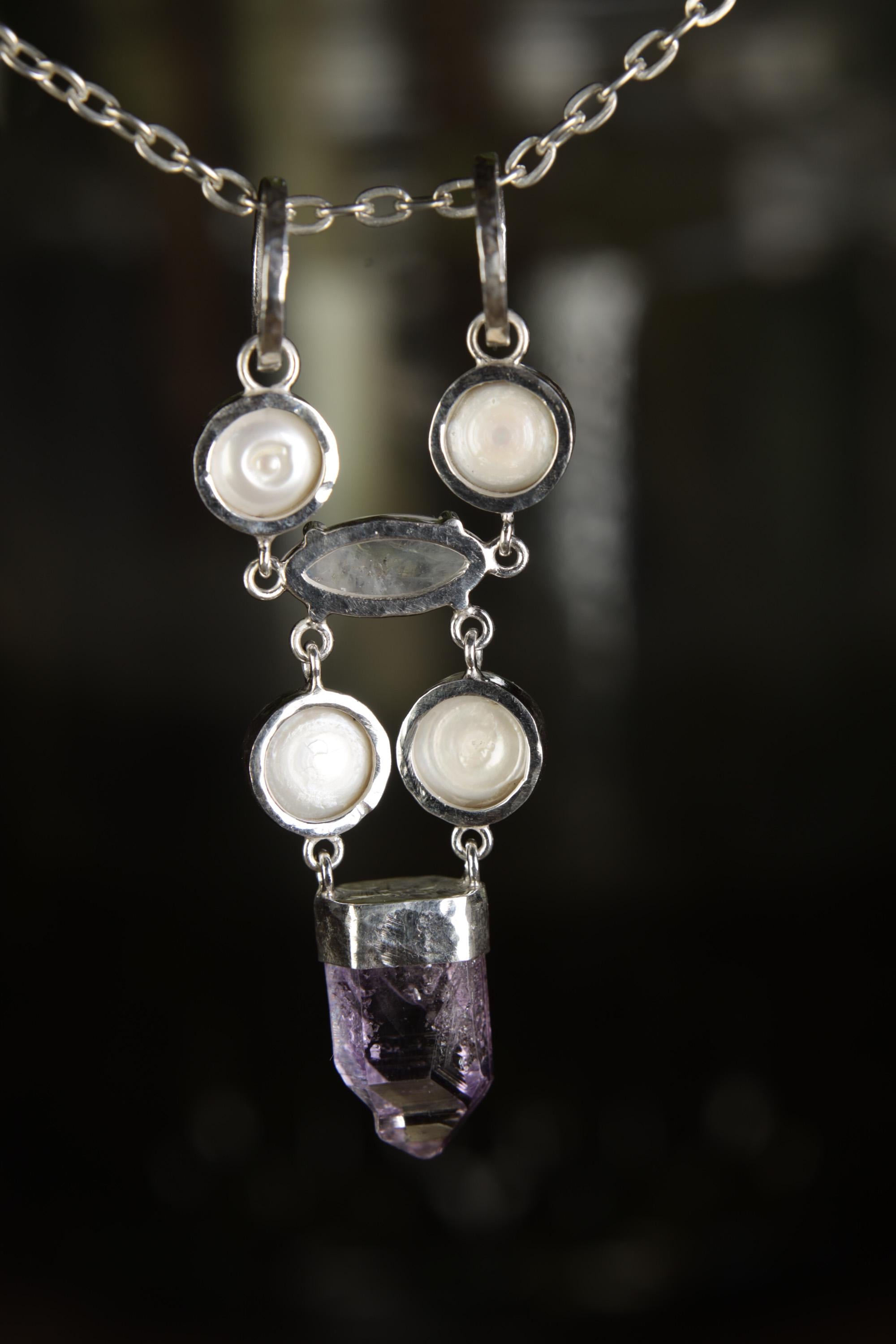 South Sea Pearl Moonstone Vera Cruz Amethyst pendant shown in natural light with high-shine silver and crystal dangle.