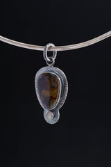 Earthen Resonance - Pietersite and Fiery Ethiopian Opal Pendant - Oxidised Sterling Silver with Sun Ray Details