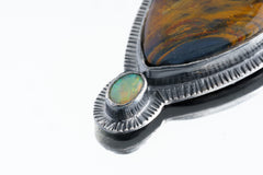 Nature's Tears - A Mesmerizing Dance of Pietersite and Ethiopian Opal - Oxidised Sterling Silver Pendant with Sun Ray Details
