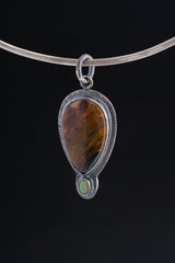 Nature's Tears - A Mesmerizing Dance of Pietersite and Ethiopian Opal - Oxidised Sterling Silver Pendant with Sun Ray Details