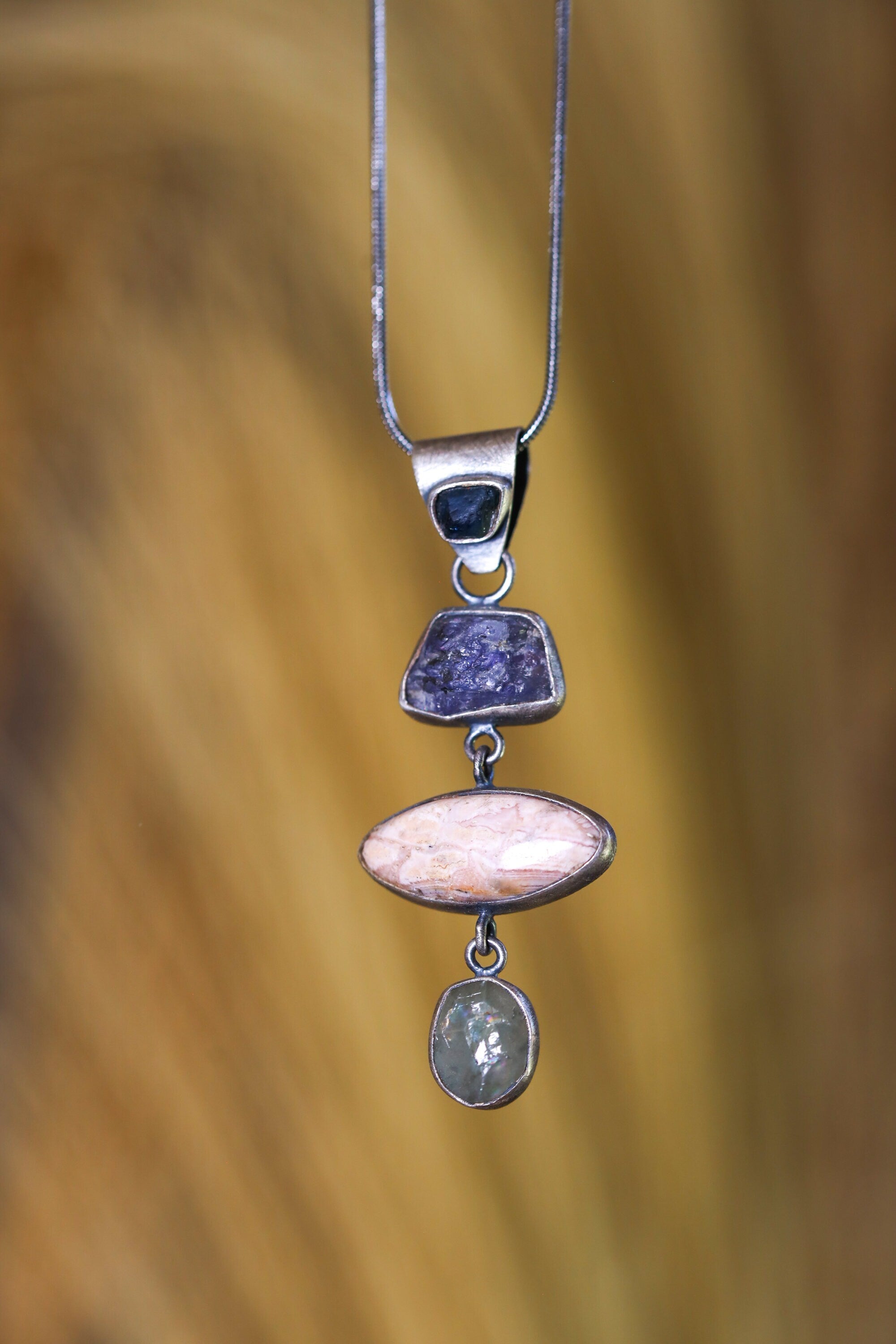 The mystical triad of Sapphire Essence Pendant: Tanzanite, Rhodochrosite, & Aquamarine - Silver Pendant - Oxidized and Brush Texture